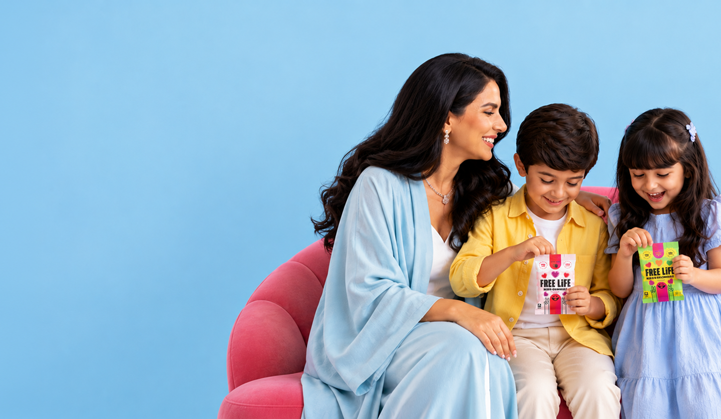 A mom and her two kids enjoying Free Life Kids Sour Gummies
